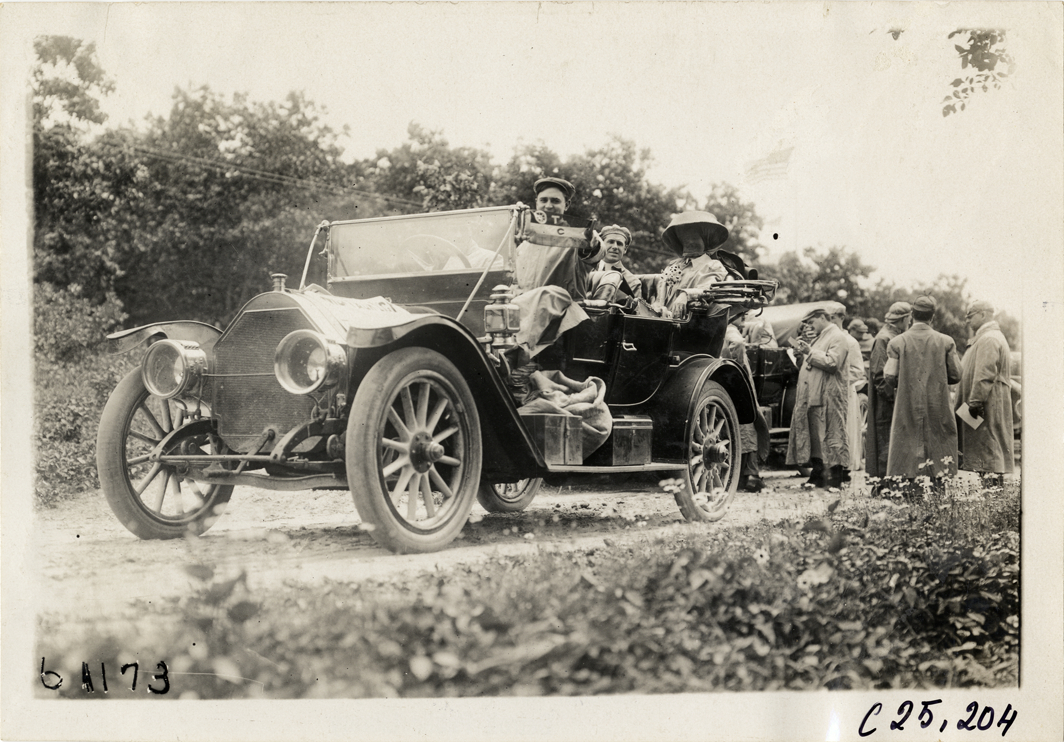 Motorists posing in automobile, 1910 Montauk Point Reliability Run