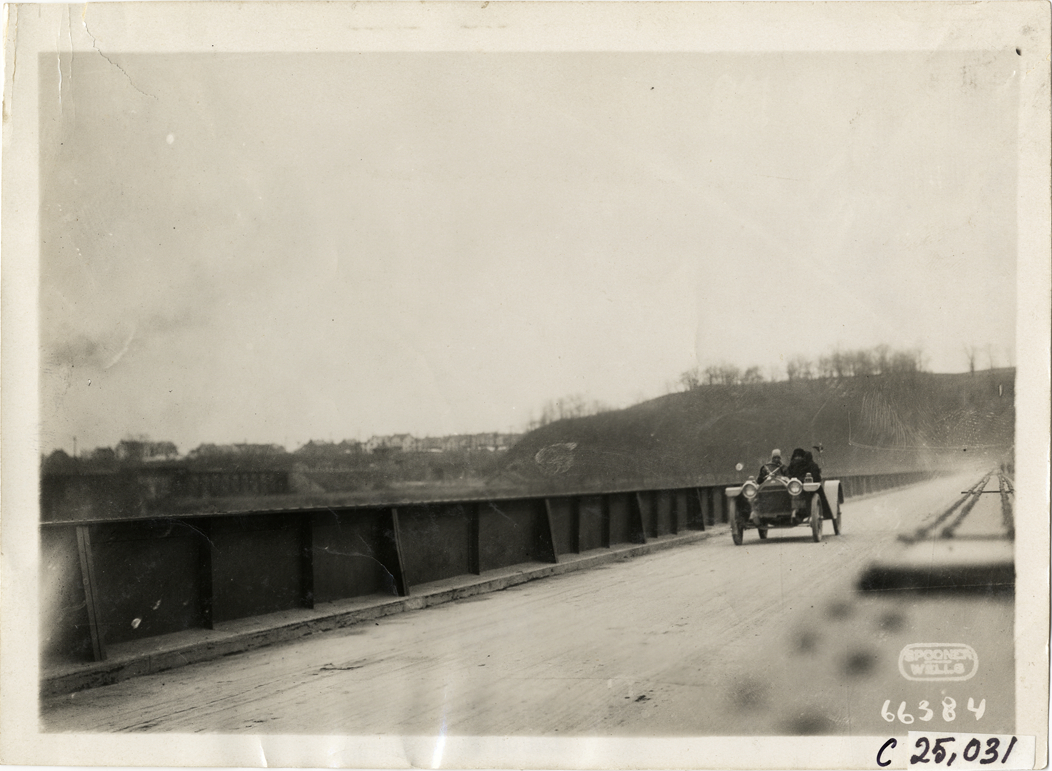 Motorists in automobile crossing bridge, 1910 Harrisburg Endurance Run