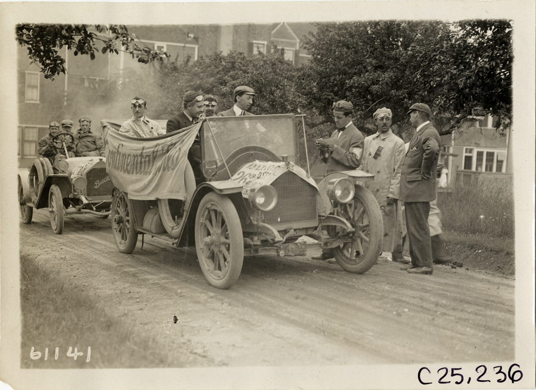 Motorists in automobile draped with Continental Tires banner, 1910 Montauk Point Reliability Run