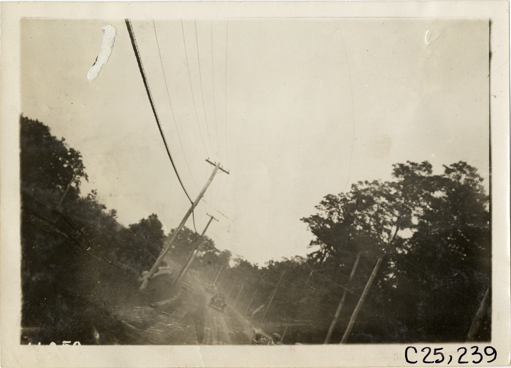 Motorists in automobiles traveling on rural road, 1910 Montauk Point Reliability Run
