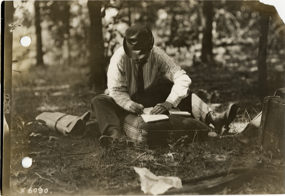 W.O. Westgard drawing a map, 1912 Glidden pathfinding expedition