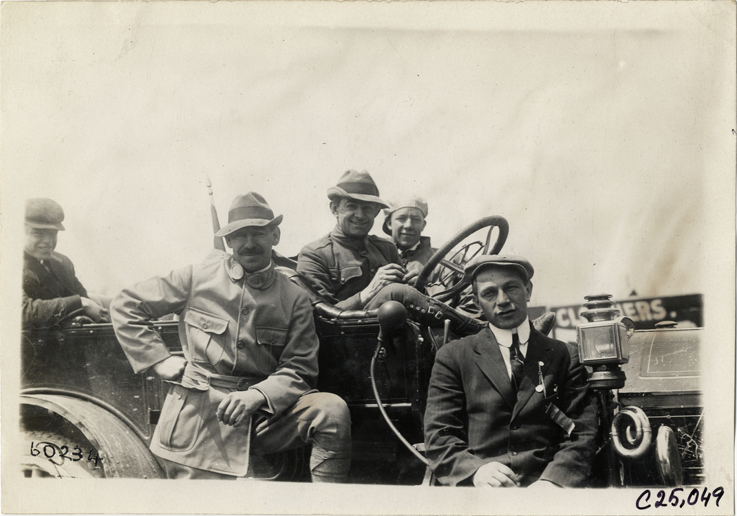 Motorists posing with automobile, 1910 Hartford Endurance Run
