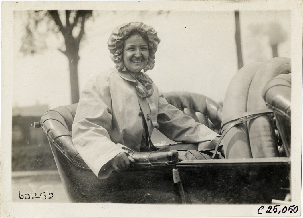 Woman posing in rear seat of automobile, 1910 Hartford Endurance Run