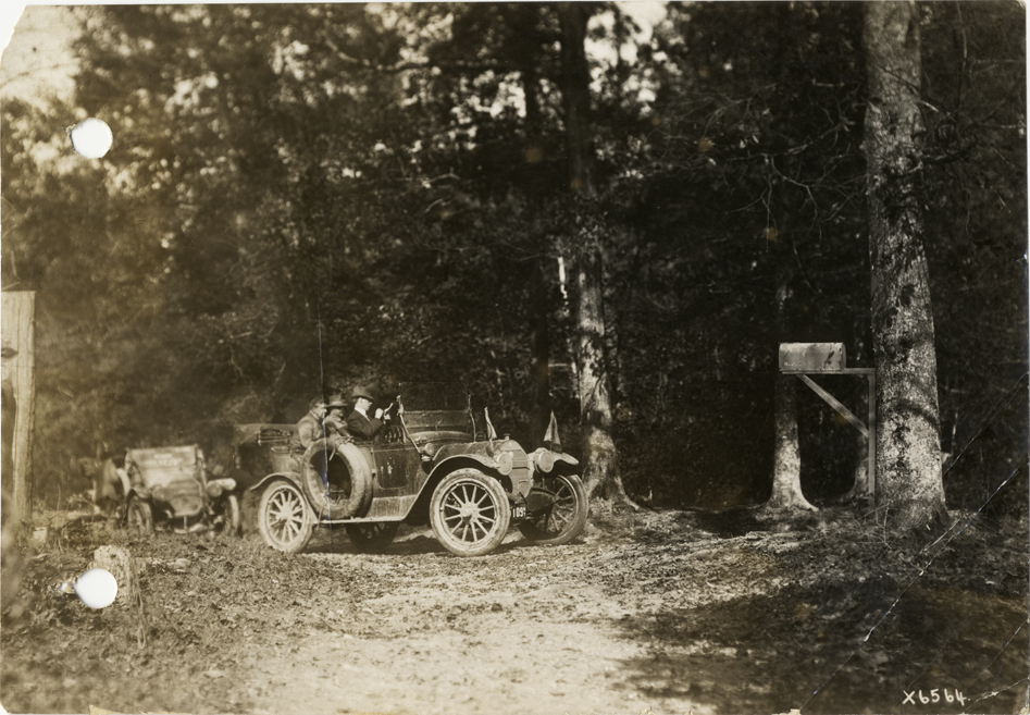 Motorists in automobiles traveling on forest road in Tennessee, 1912 Glidden Tour