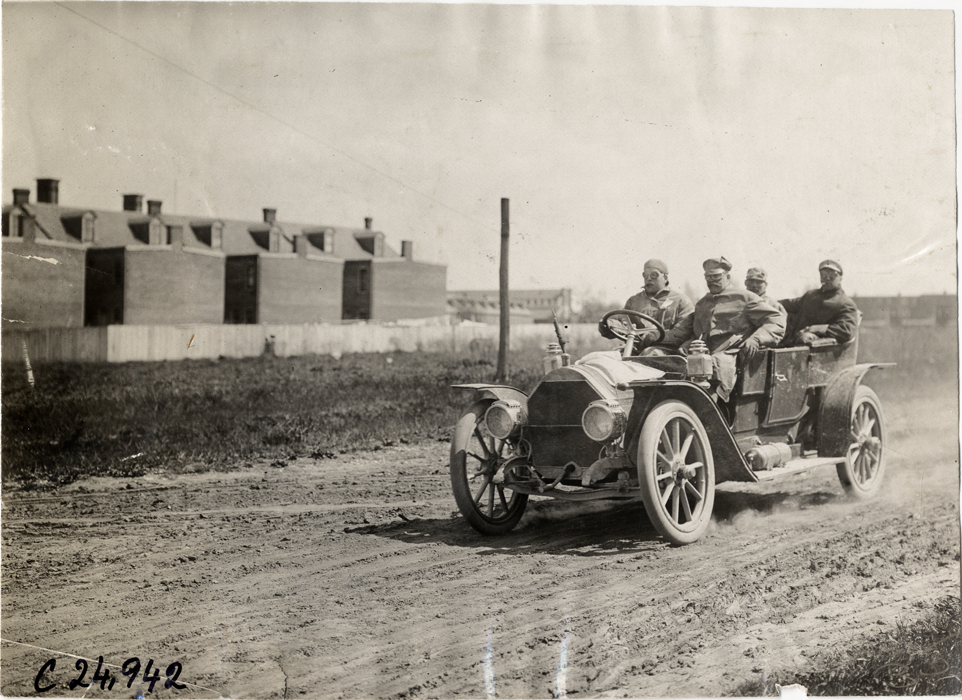 Motorists in automobile traveling on dirt road, 1909 Harrisburg Endurance Run