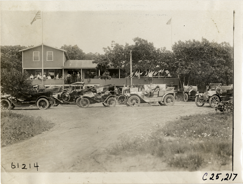 Automobiles parked in front of building, 1910 Montauk Point Reliability Run