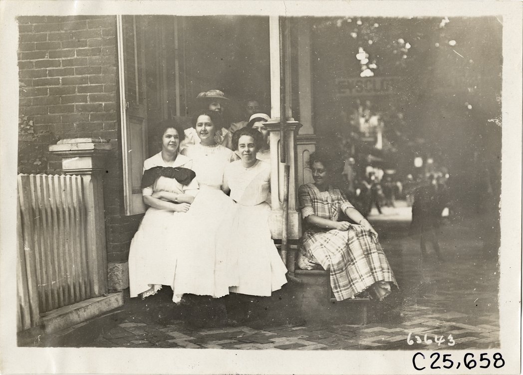 Women posing on porch, 1910 Munsey Historic Tour