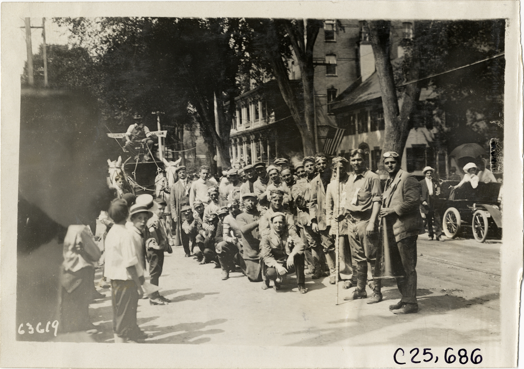 Motorists posing in street, 1910 Munsey Historic Tour