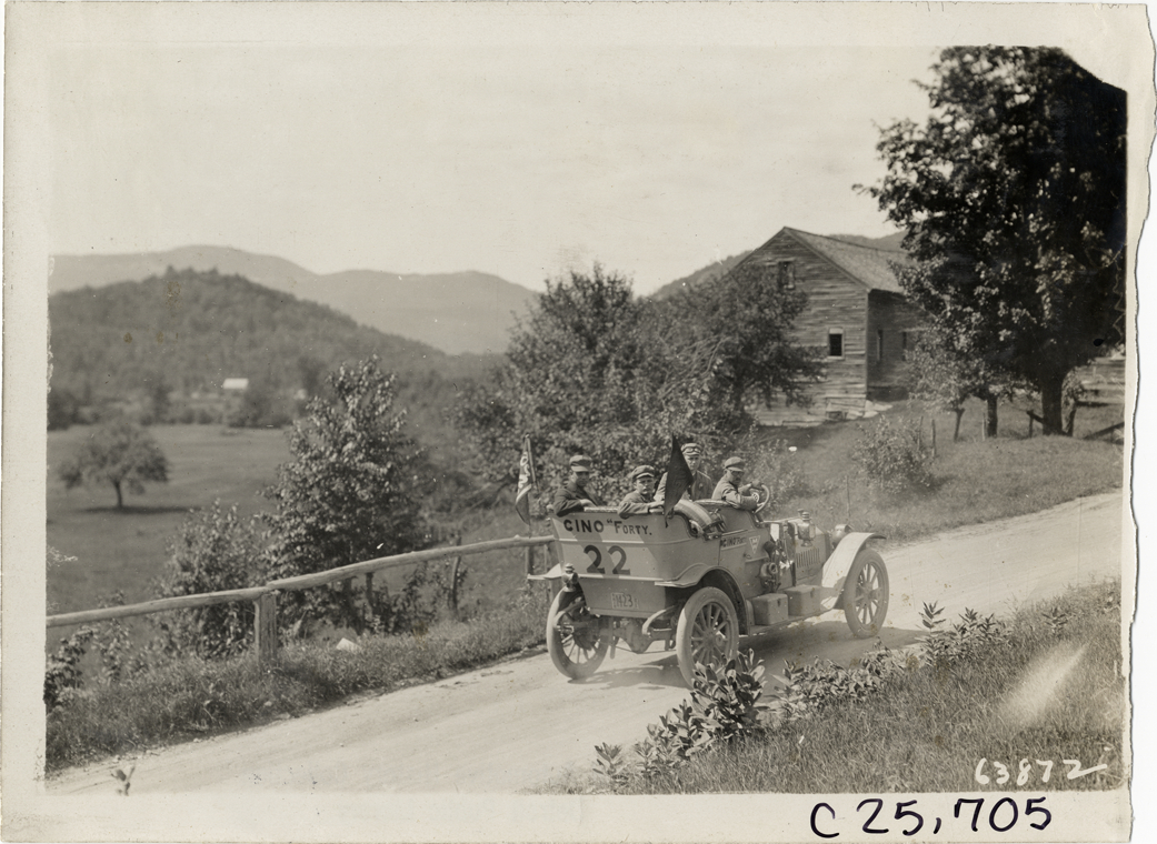Motorists posing in Cino automobile on rural road, 1910 Munsey Historic Tour