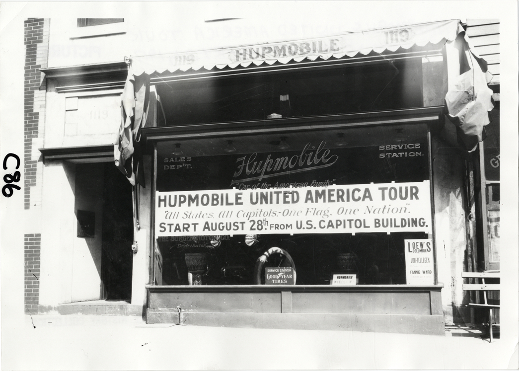 Banner on Hupmobile dealership window, Hupmobile United American Tour