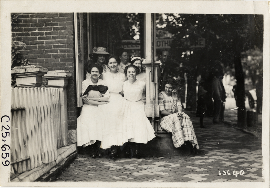 Women posing on porch, 1910 Munsey Historic Tour