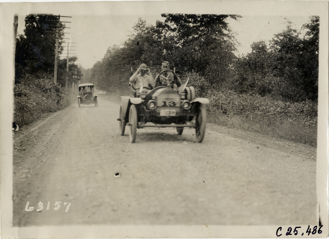 Brush automobile traveling on rural road, 1910 Munsey Historic Tour