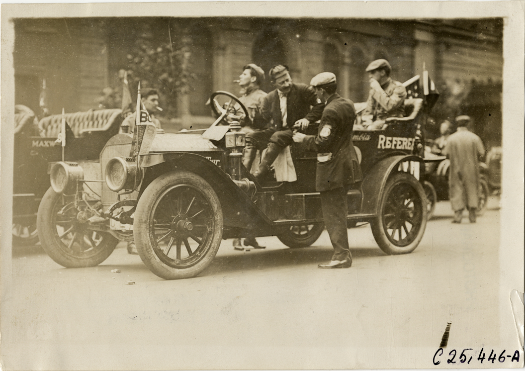 Officials with Columbia referee automobile, 1910 Munsey Historic Tour