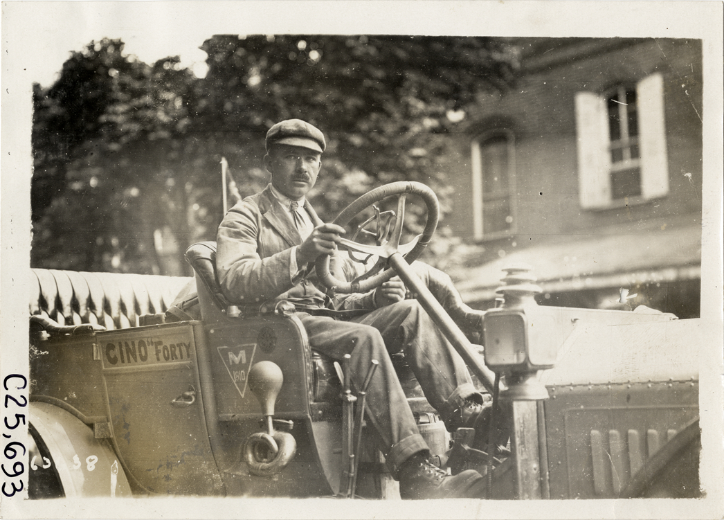 Driver posing in Cino automobile, 1910 Munsey Historic Tour