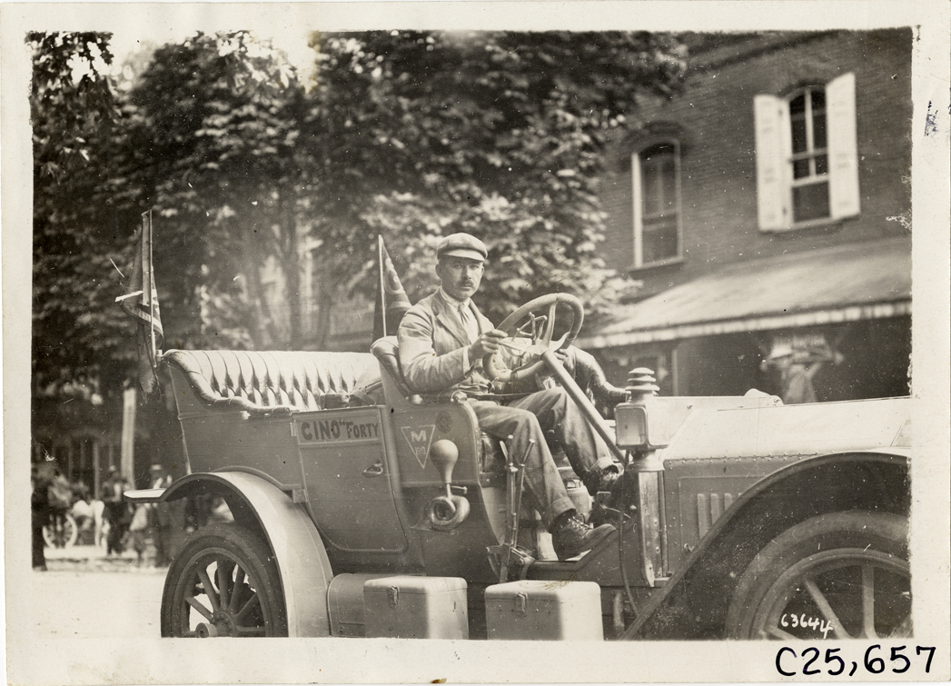 Driver posing in Cino automobile, 1910 Munsey Historic Tour