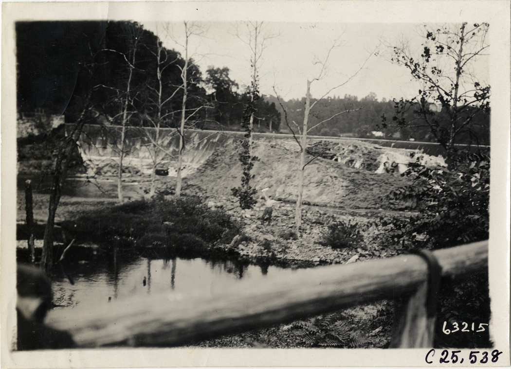 Man waving at edge of lake, 1910 Munsey Historic Tour