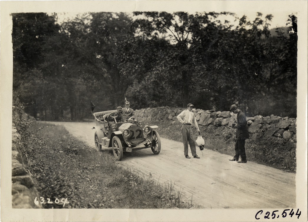 Motorists with Cino automobile on rural road, 1910 Munsey Historic Tour