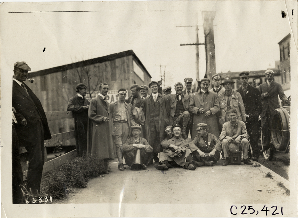 Motorists posing on sidewalk, 1910 Munsey Historic Tour