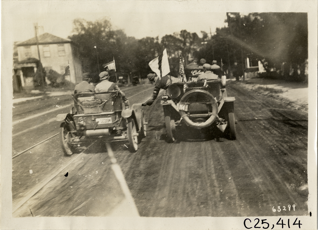 Automobiles traveling side by side, 1910 Munsey Historic Tour