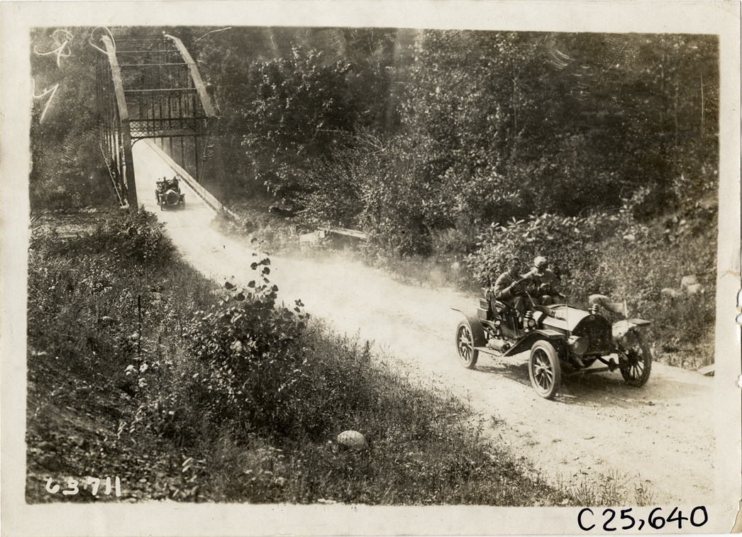 Automobiles crossing toll bridge, 1910 Munsey Historic Tour