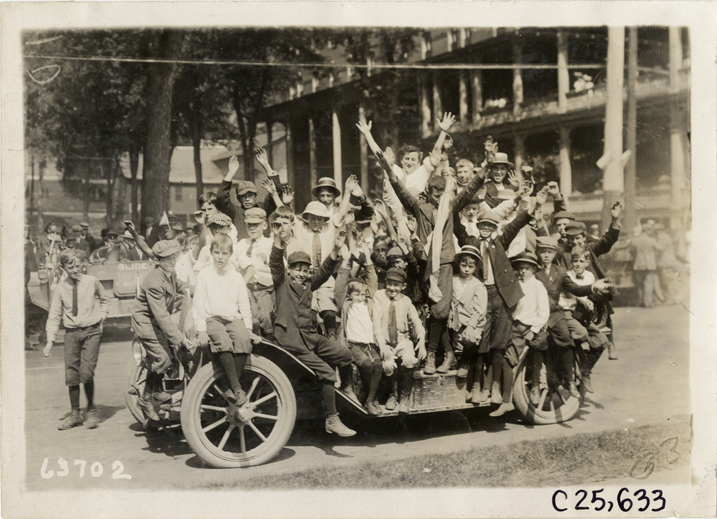Boys posing on automobile at Montpelier, Vermont, 1910 Munsey Historic Tour