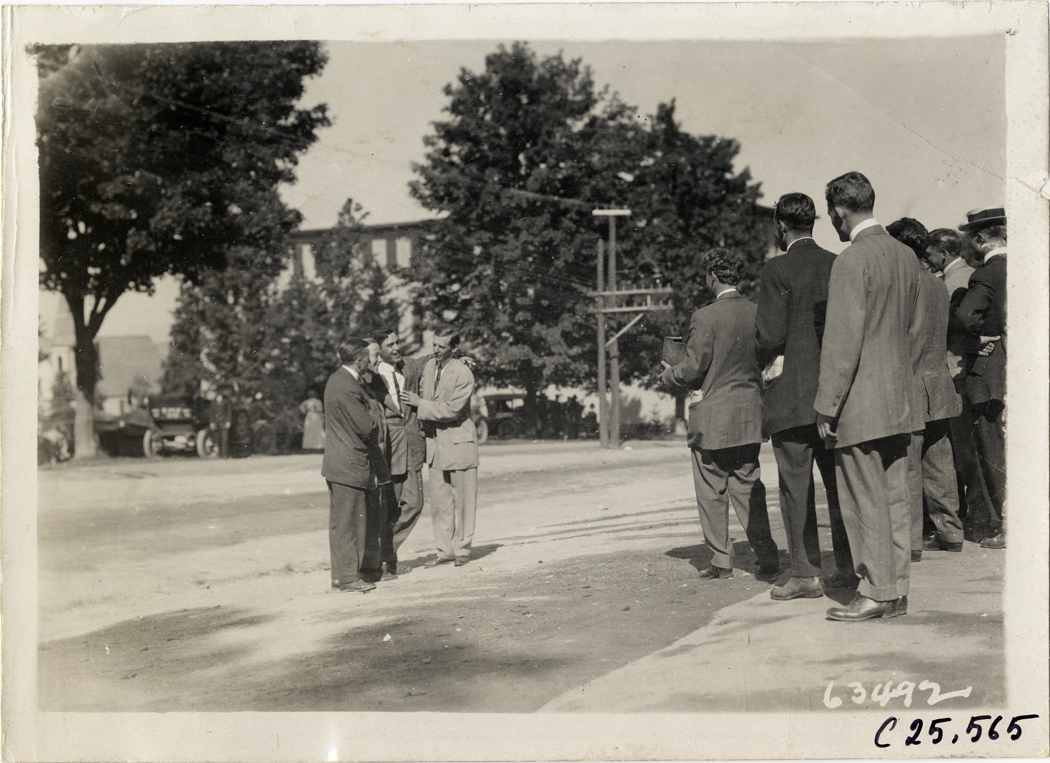 Group of men posing for photographer, 1910 Munsey Historic Tour