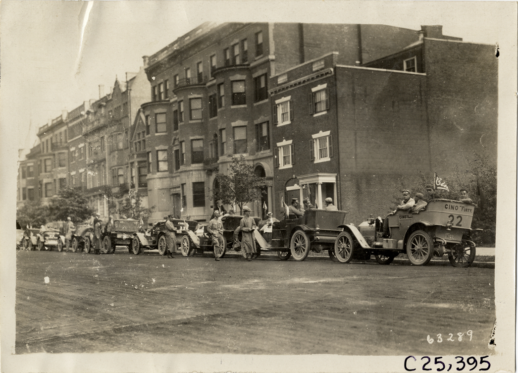 Motorists in automobiles parked in street, 1910 Munsey Historic Tour