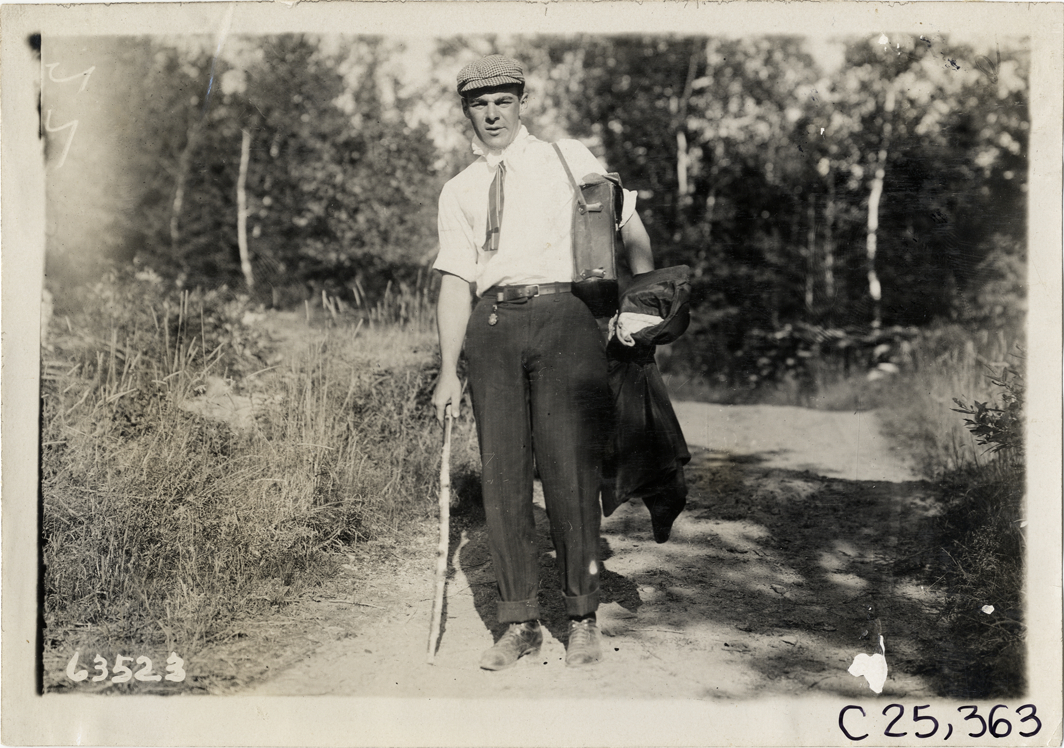 Man posing on trail, 1910 Munsey Historic Tour