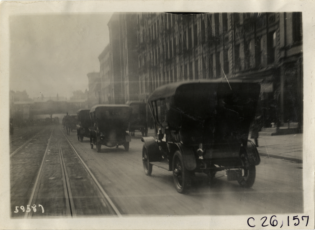 Automobiles lined up in street, 1910 New Jersey Reliability Run