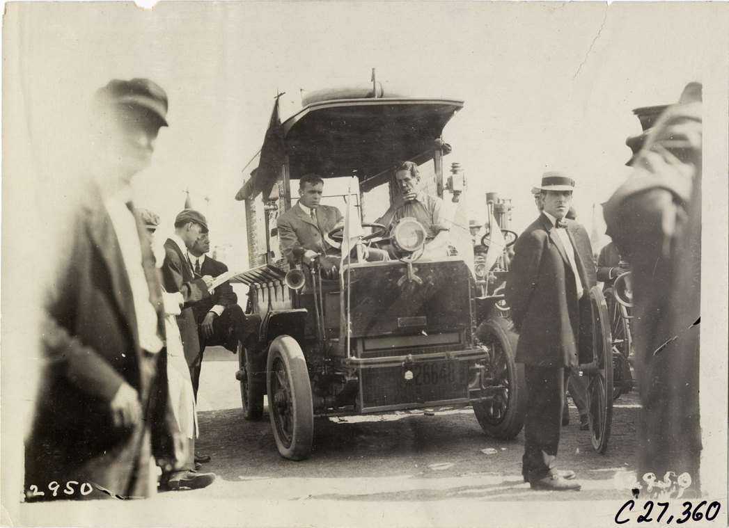 Men posing in truck, 1910 North American Run