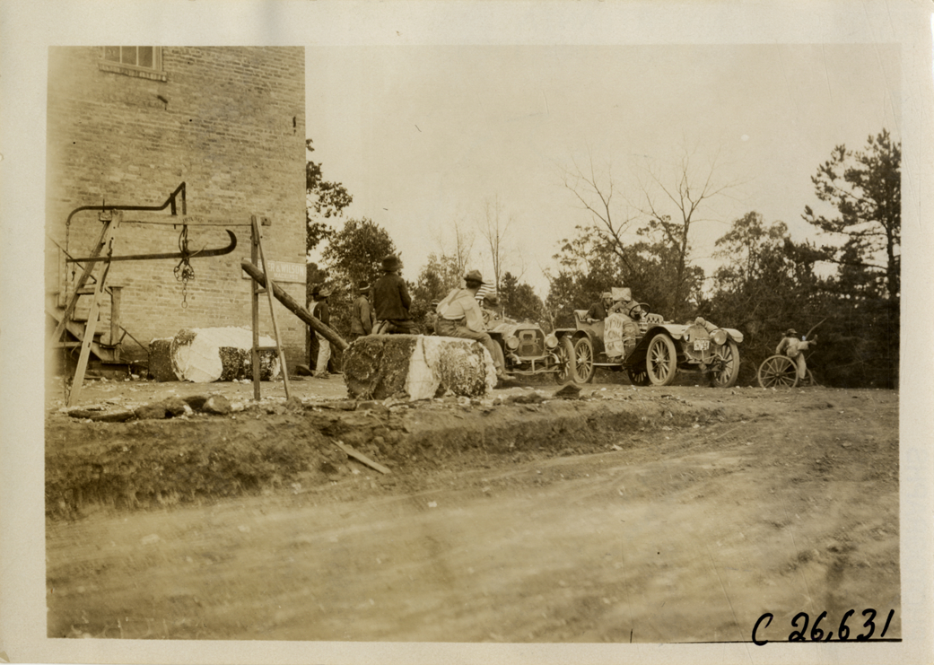 Automobiles in front of factory building, 1909 New York-Atlanta Good Roads Tour
