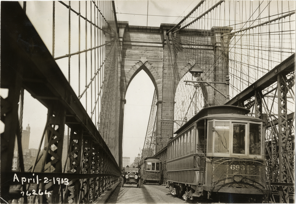 National automobile passing streetcars on Brooklyn Bridge, 1913 Overman tires 10,000 mile demonstration