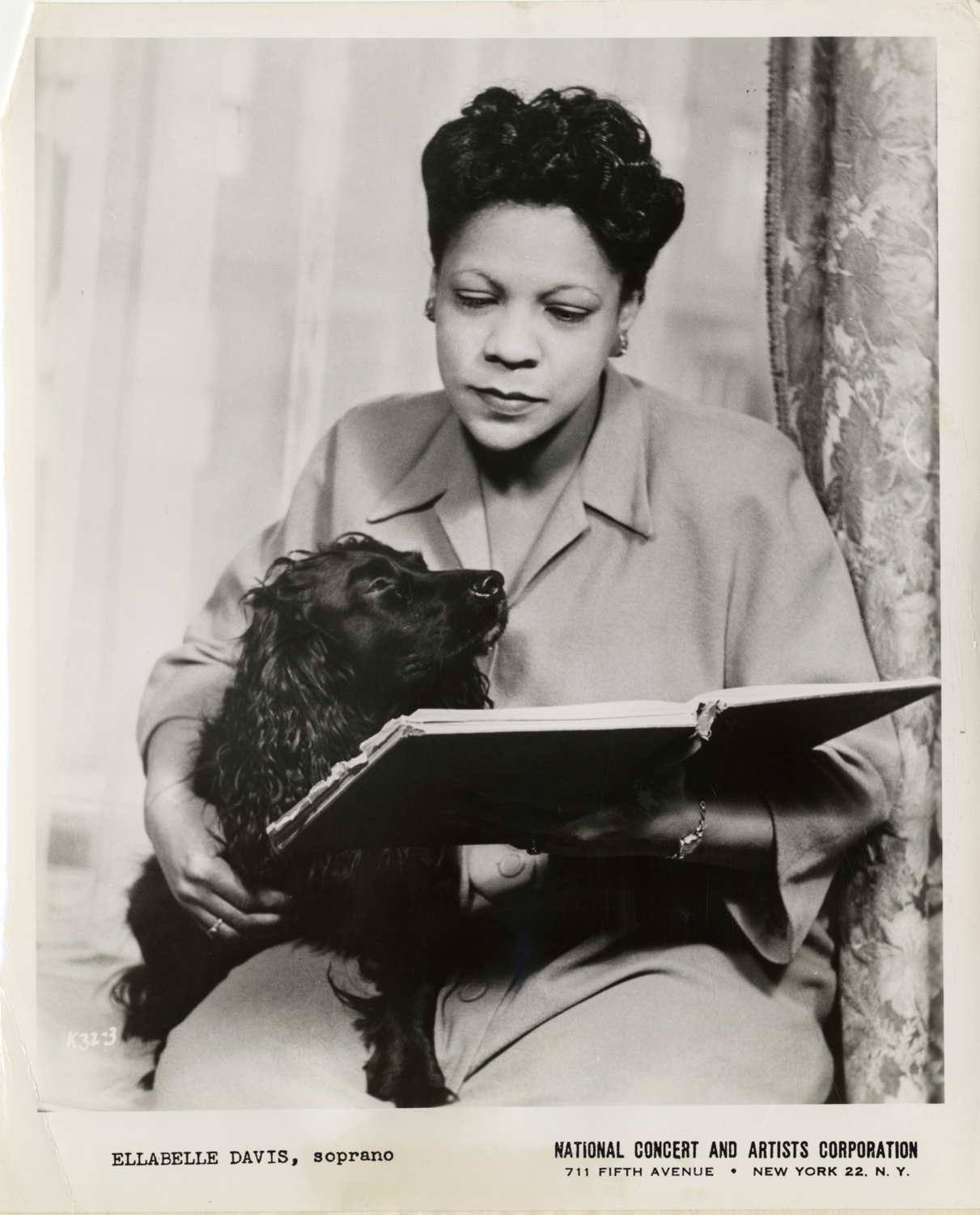 Ellabelle Davis with pet cocker spaniel, "Aida"