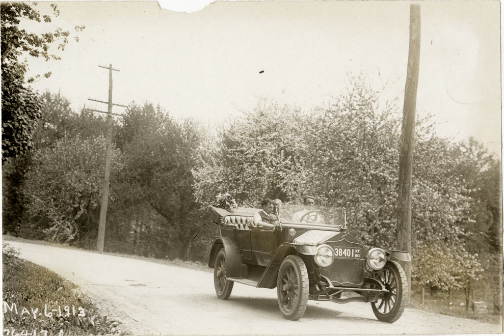Motorists in National automobile on rural road, 1913 Overman tires 10,000 mile demonstration