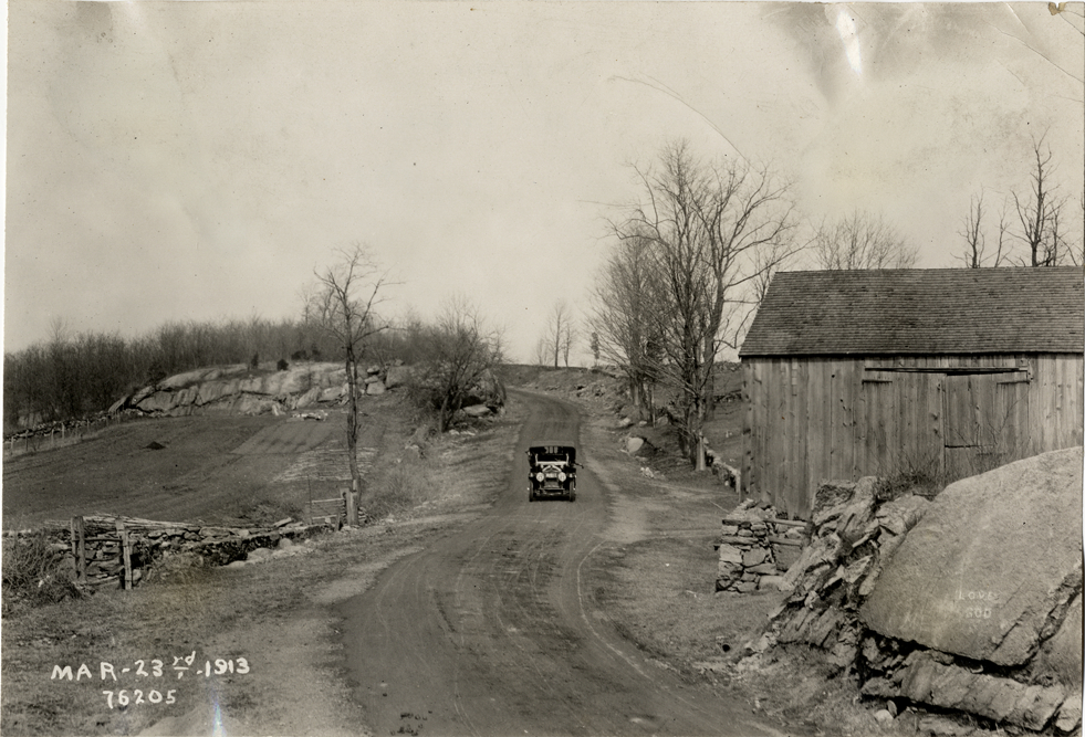National automobile traveling on rural road, 1913 Overman tires 10,000 mile demonstration