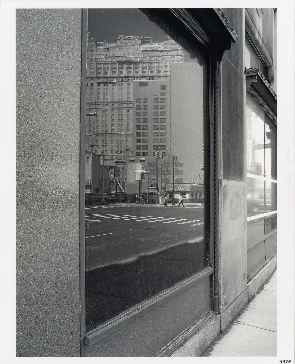 Tubby's Submarines reflected in building window