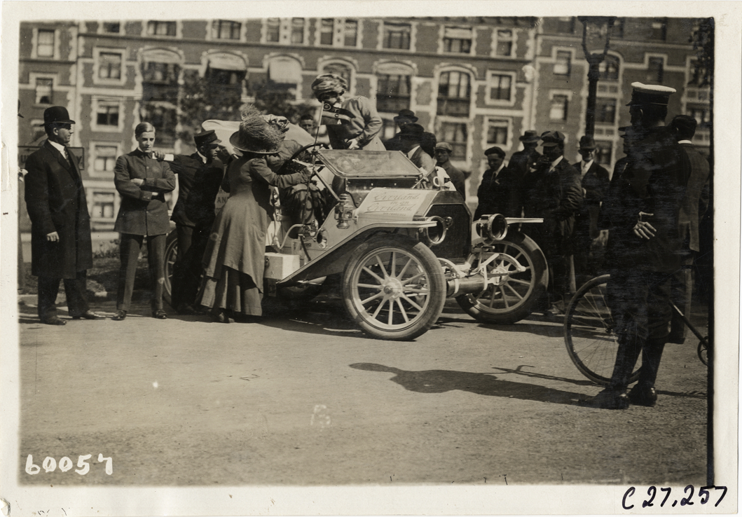 Spectators surrounding Overland automobile, 1910 New York to San Francisco tour