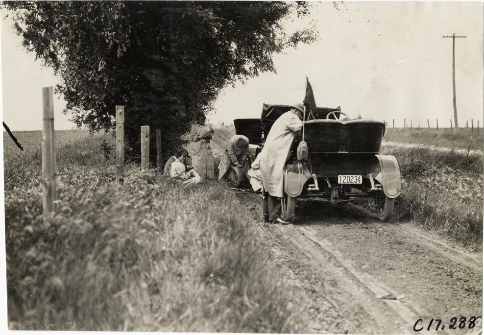 Alice Ramsey sitting on roadside, Alice H. Ramsey tour