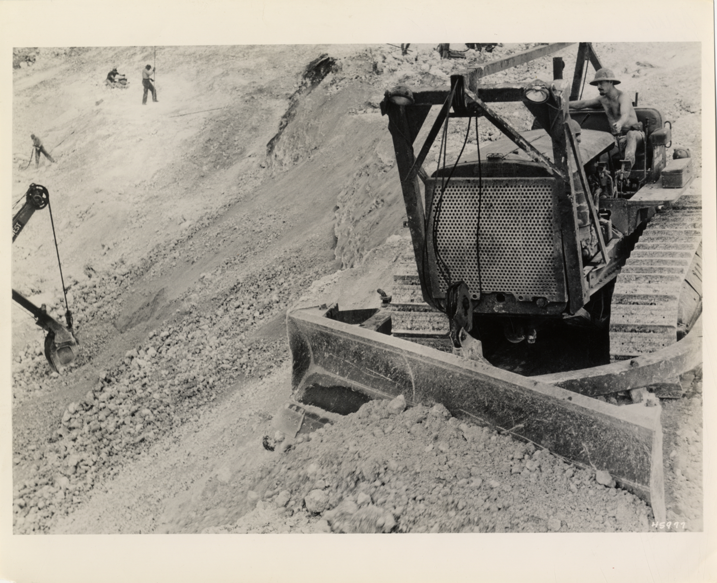 Caterpillar D8 diesel tractor with LeTourneau angledozer in quarry, Mariana Islands