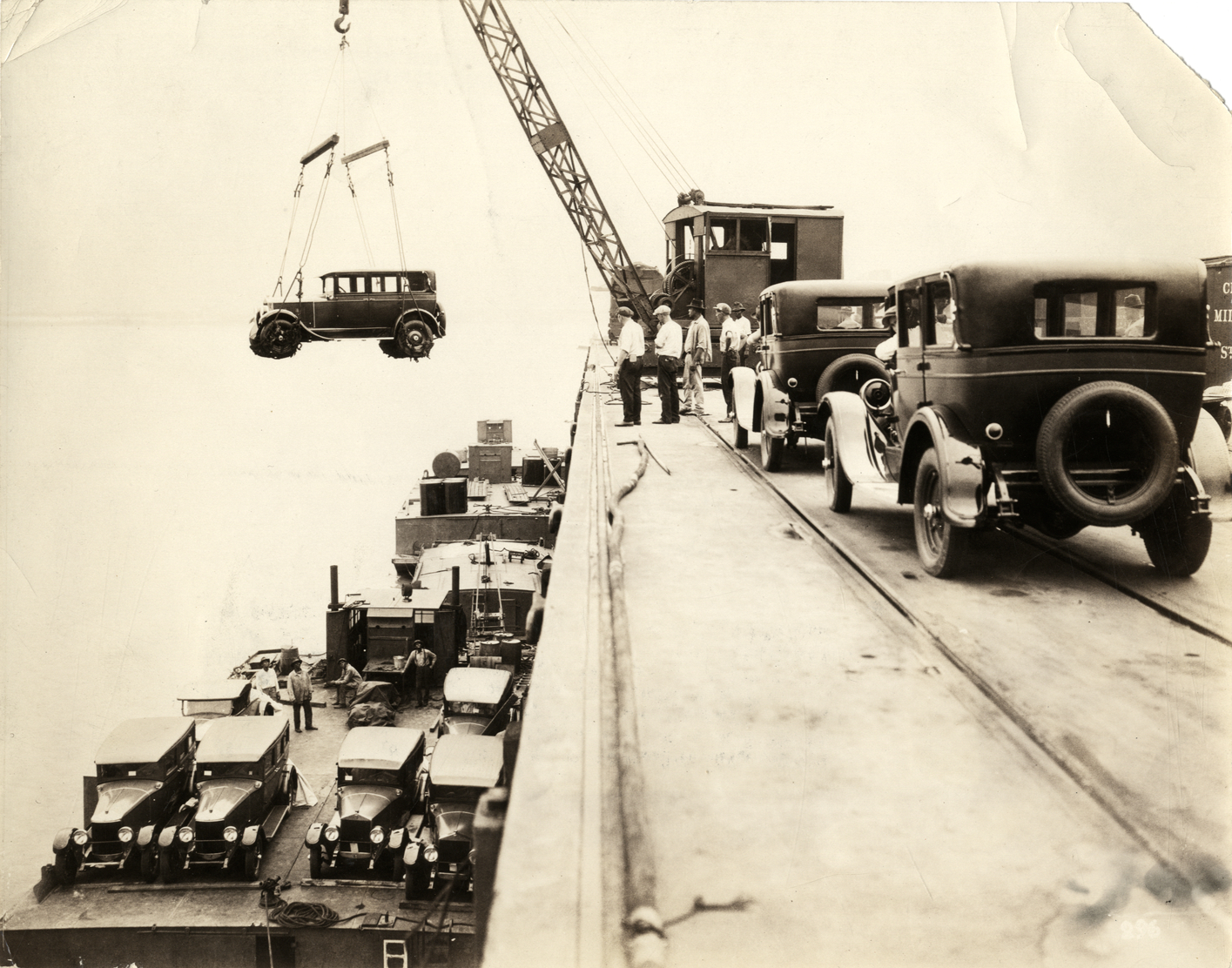 Moon automobile being lowered onto River Transit Company barge