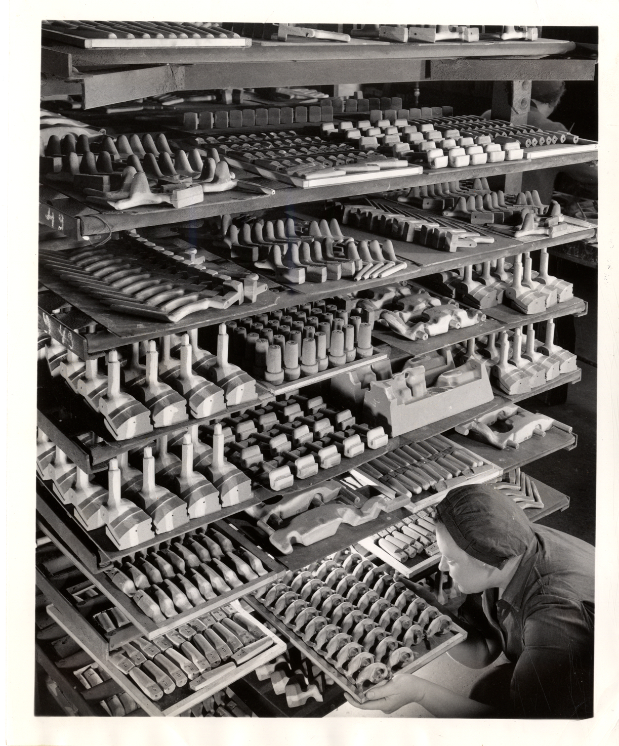 Woman worker with cores for molds, Chevrolet Division foundry