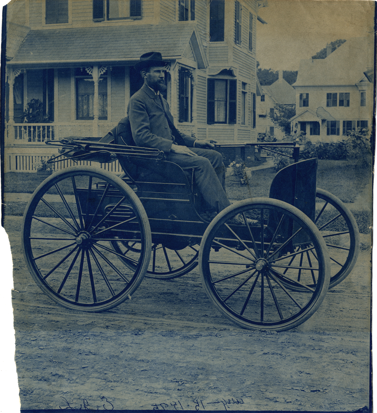 Charles E. Duryea posing in 1895 Duryea phaeton