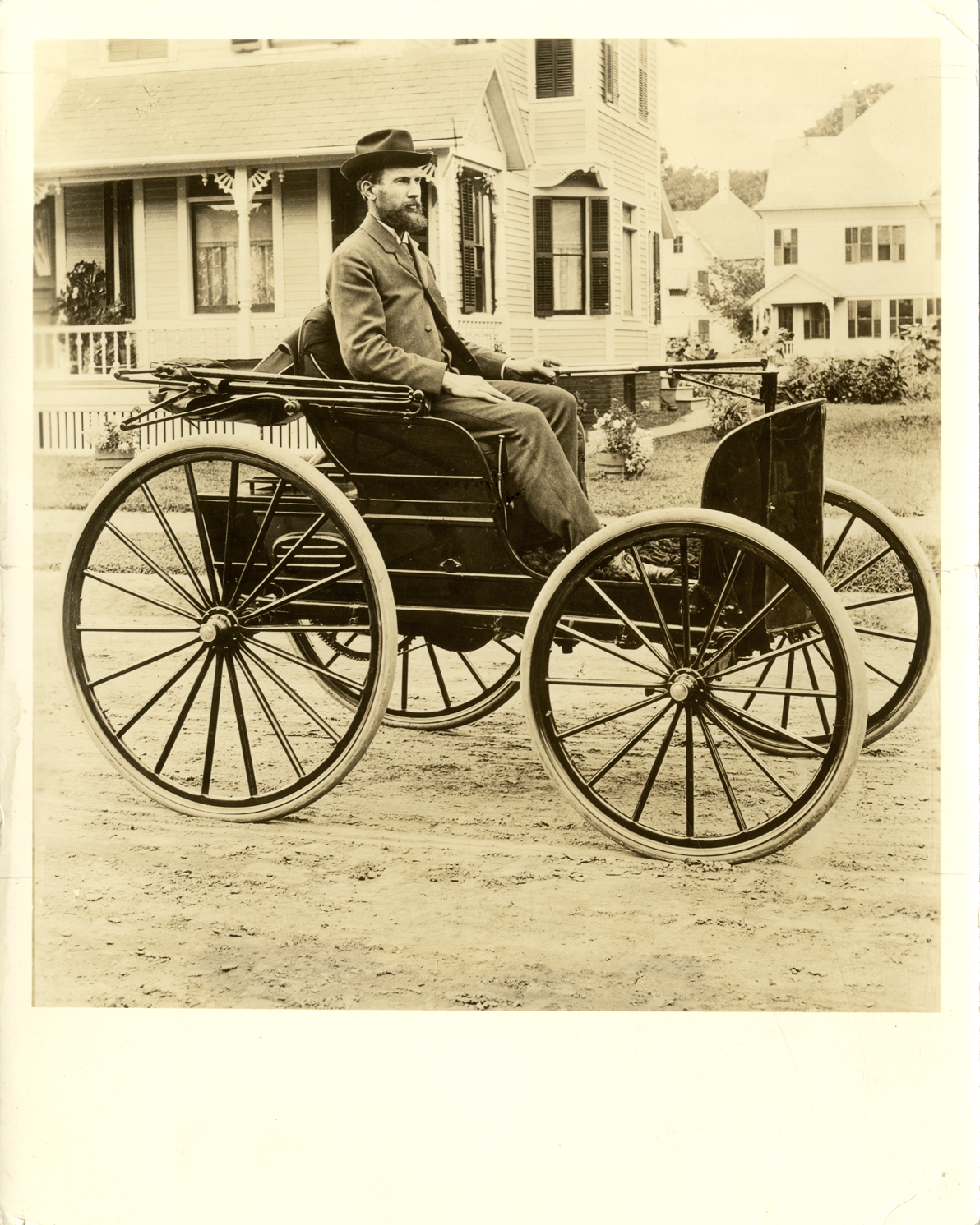 Charles E. Duryea posing in 1895 Duryea phaeton
