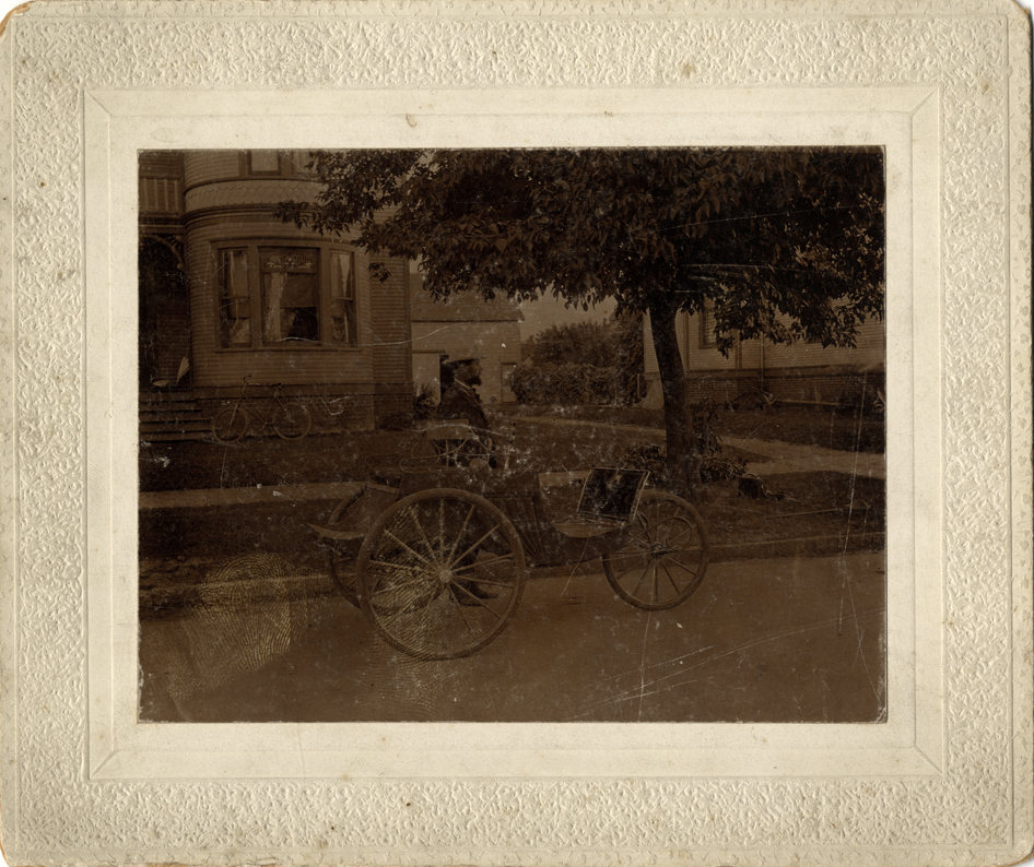 Charles Duryea driving an 1898 Duryea dos-a-dos trap