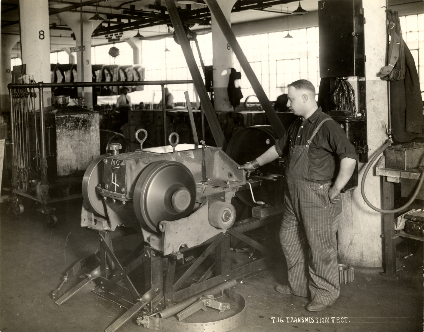 Worker testing a T-16 transmission