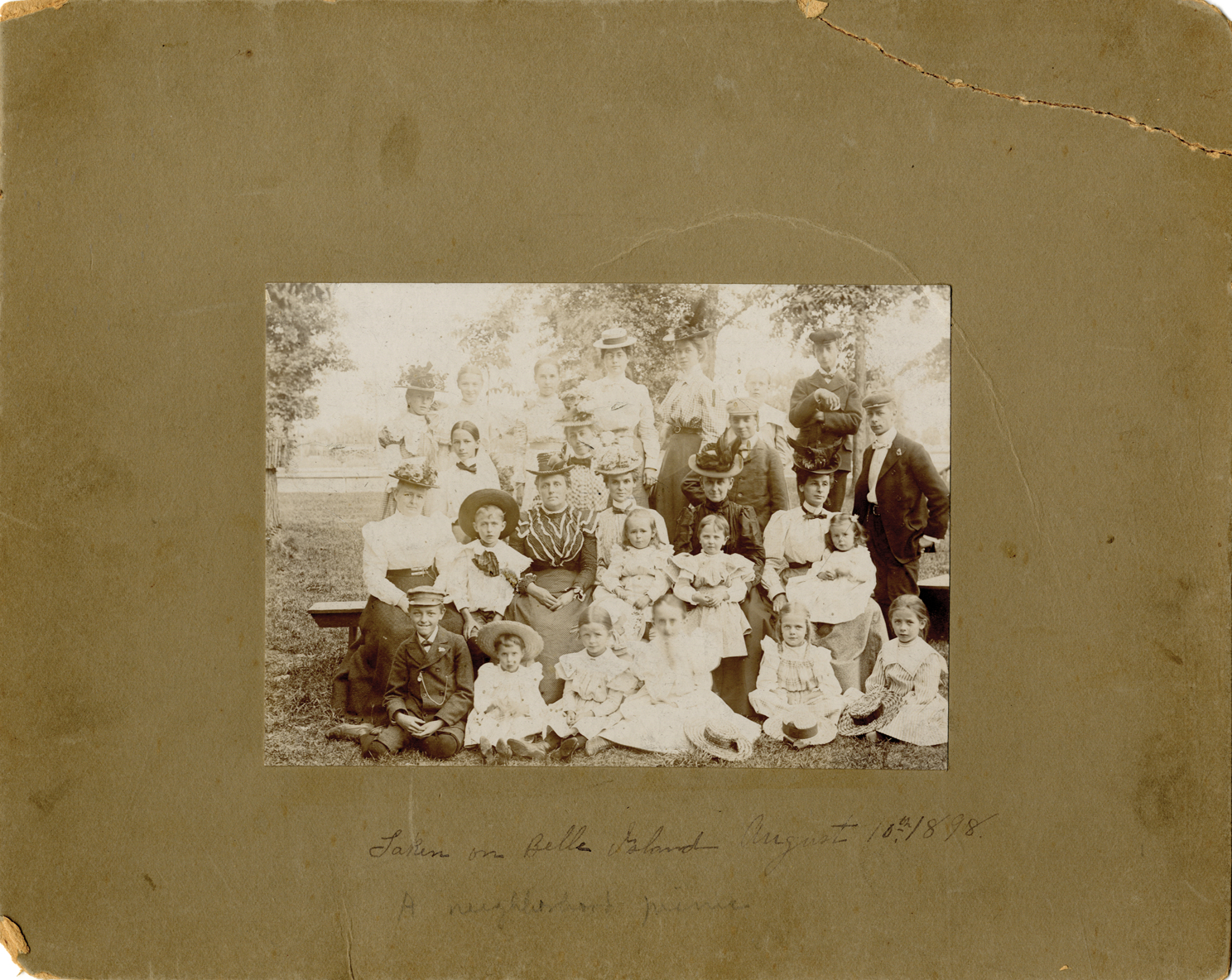 Men, women and children at picnic on Belle Isle