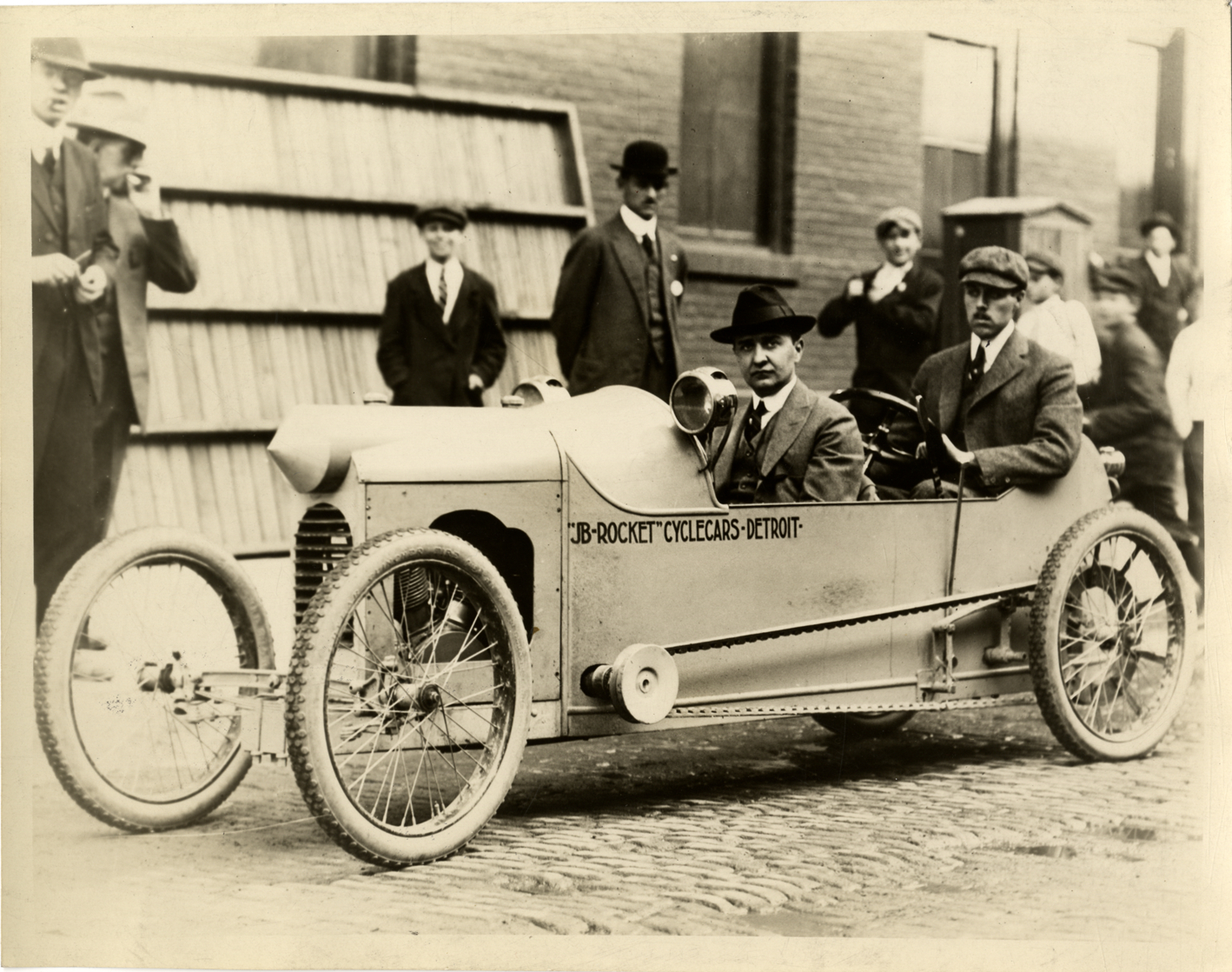 John Scripps Booth and John Batterman posing in a JB Rocket cyclecar