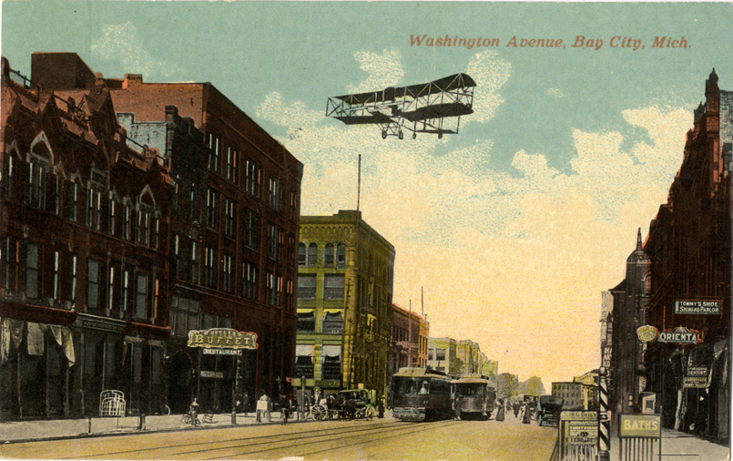 Airplane flying over Washington Avenue, Bay City, Michigan