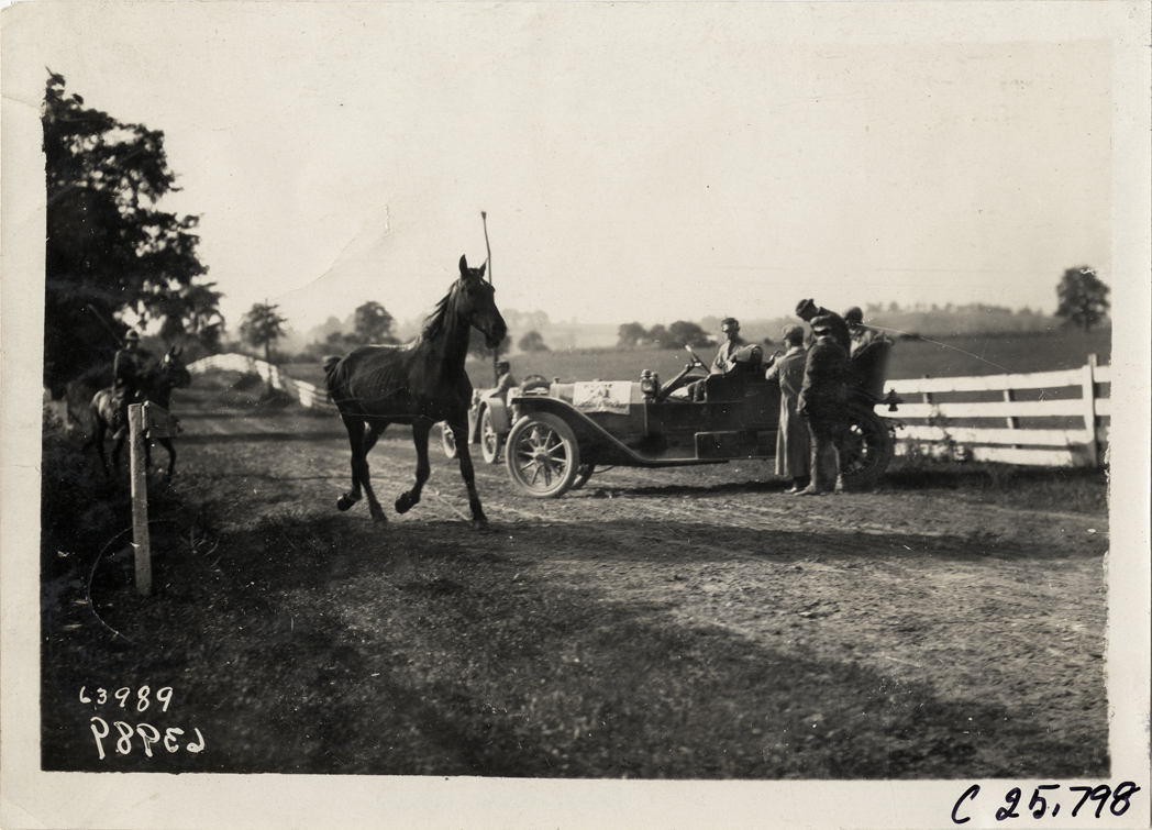 Horse running past automobiles on roadside, 1910 Munsey Historic Tour