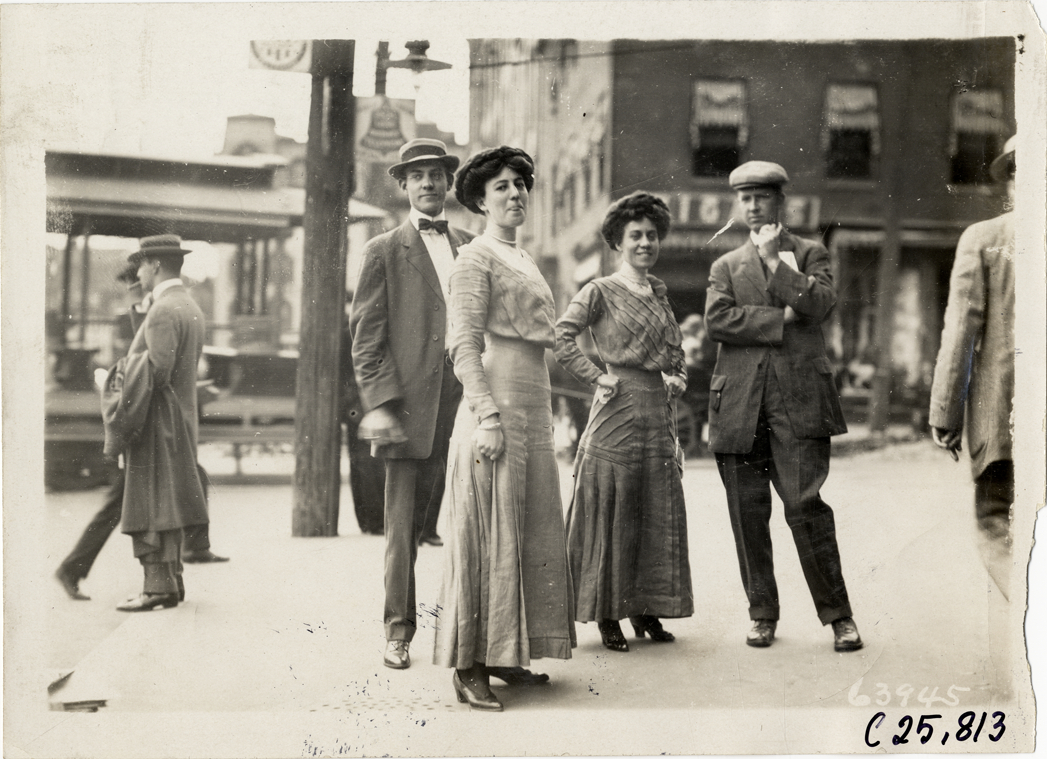 Two couples posing on sidewalk, 1910 Munsey Historic Tour